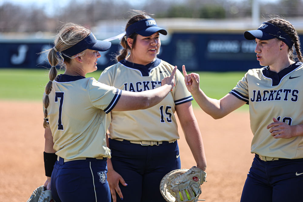 Softball 3 player huddle